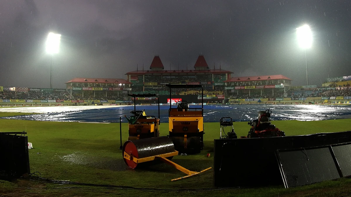 A view of the pitch at Dharamsala cricket stadium covered with plastic sheets during rains ahead of the first T20I match between India and South Africa on Sep 15, 2019. (Photo: Surjeet Yadav/IANS)