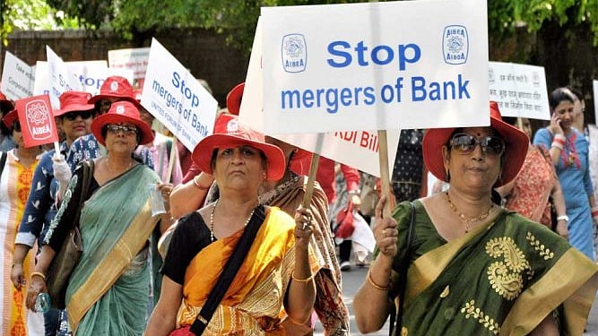 Bank employees protest against the mergers (PTI photo).