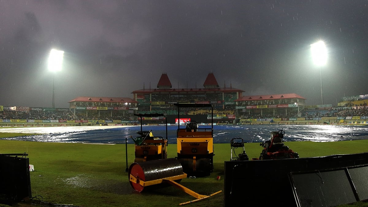 A view of the pitch at Dharamsala cricket stadium covered with plastic sheets during rains ahead of the first T20I match between India and South Africa on Sep 15, 2019. (Photo: Surjeet Yadav/IANS)