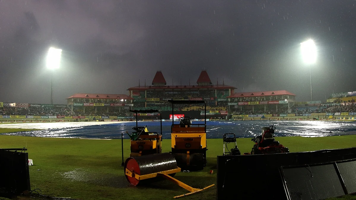 A view of the pitch at Dharamsala cricket stadium covered with plastic sheets during rains ahead of the first T20I match between India and South Africa on Sep 15, 2019. (Photo: Surjeet Yadav/IANS)