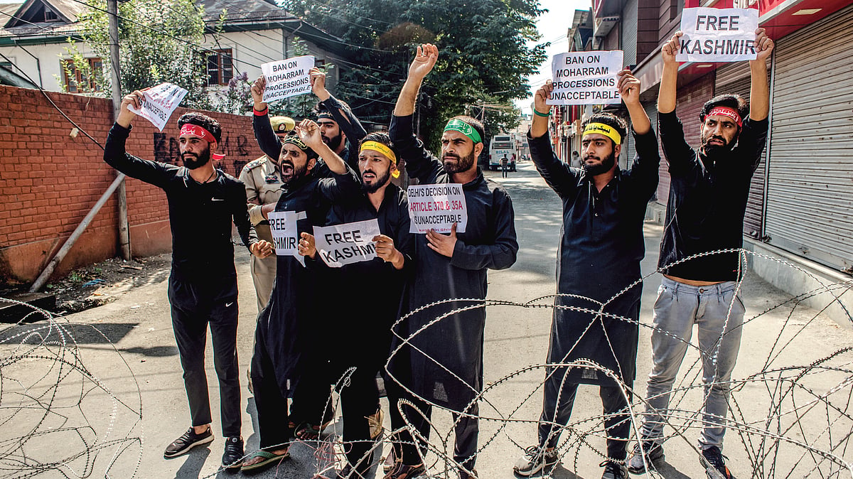 Shiite mourners protest curfew-like restrictions in Srinagar on September 8 even as dozens of them were detained by police as they tried to take part in processions during Muharram