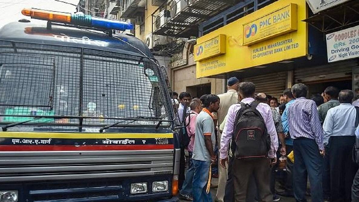 Hapless customers throng a branch of the PMC Bank in Mumbai (PTI photo)