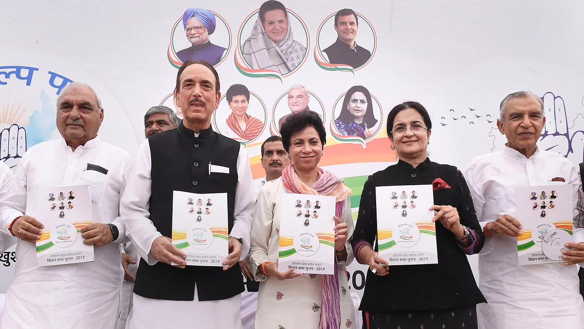 Haryana Congress president Kumari Selja flanked by senior leader Ghulam Nabi Azad and manifesto committee chairperson Kiran Chaudhary with others release party’s manifesto for state Assembly polls on Friday, Oct. 11, 2019. (PTI Photo).