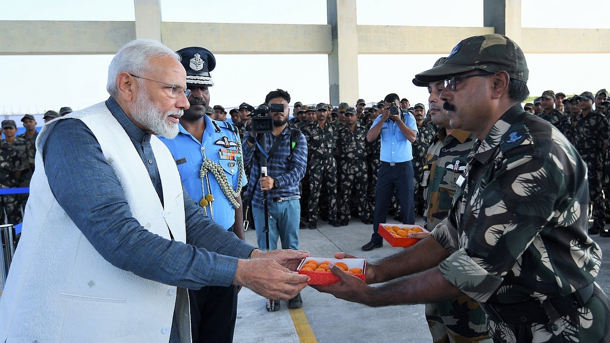 PM Modi distributing laddu to soldiers in Rajouri, Jammu and Kashmir on Diwali day, October 27, 2019 (Photo courtesy: PIB)