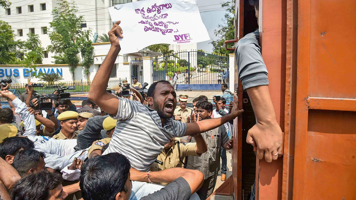 Police personnel detain the agitating employees of different unions of Telangana State Road Transport Corporation (PTI Photo)