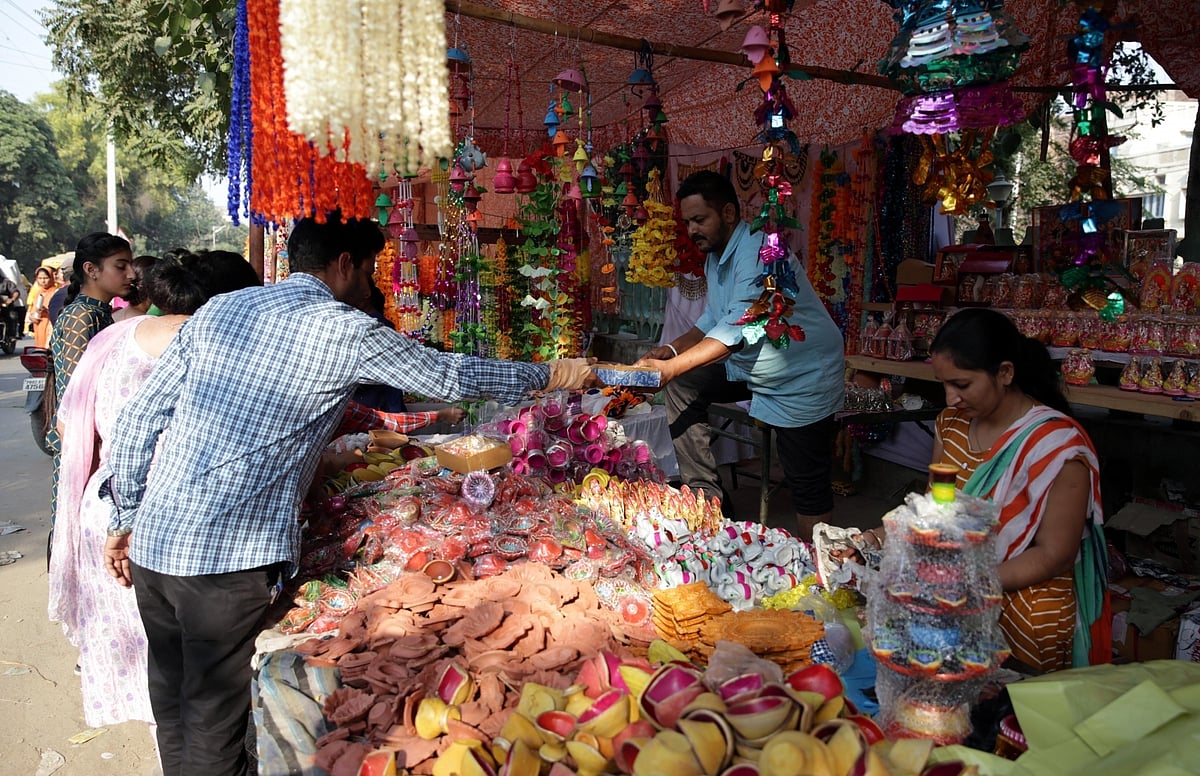 People buying colourful earthen lamps to deck up their homes on the festival of lights.