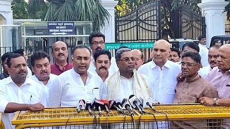 Karnataka Congress leaders outside Raj Bhavan in Bengaluru after giving a memorandum to state’s Governor Vajubhai Vala on Saturday (Photo courtesy: INC Twitter handle)