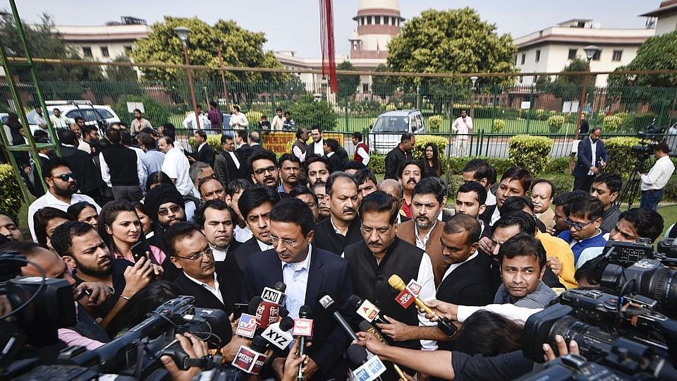 Congress spokesman Randeep Surjewala and former Maharashtra CM Prithviraj Chavan addressing media outside Supreme Court on Sunday.