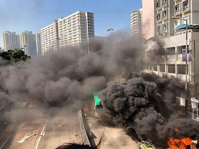 Police shoot protester, man set alight in day of Hong Kong fury