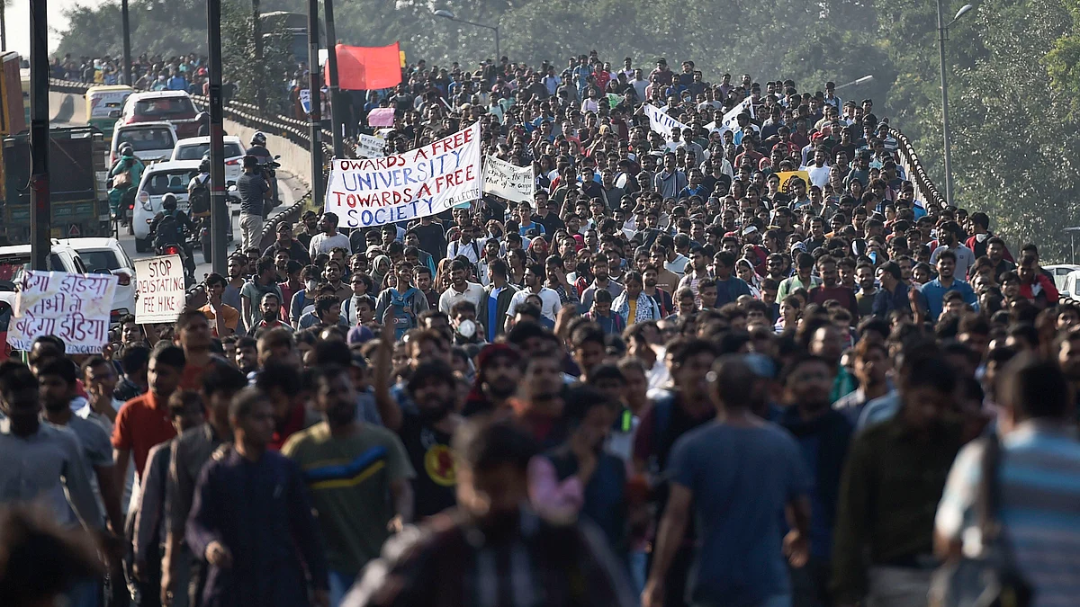 Jawaharlal Nehru University students during a protest march towards Parliament, on the first day of the Winter Session, in New Delhi, Monday (PTI Photo)
