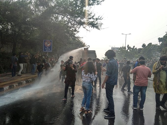JNU students protest against fee hike, police use water canons