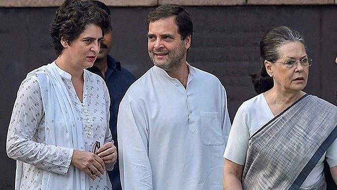 (L-R) Priyanka and Rahul with mother Sonia Gandhi.