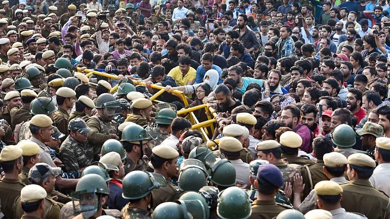 JNU students protesting against the fees hike near varsity campus on Tuesday (PTI photo)