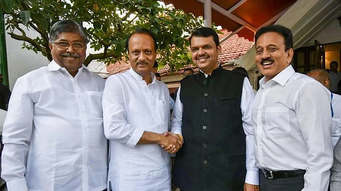 Ajit Pawar (centre) with Devendra Fadnavis after taking oath as Dy CM on Nov 23.