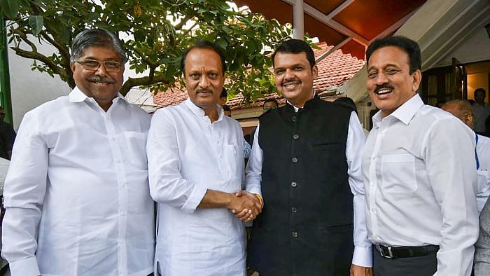 Ajit Pawar (centre) with Devendra Fadnavis after taking oath as Dy CM on Nov 23.