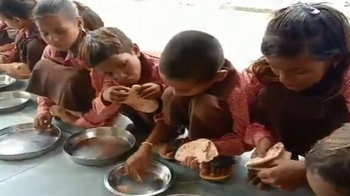  Government primary school being served flat bread with salt