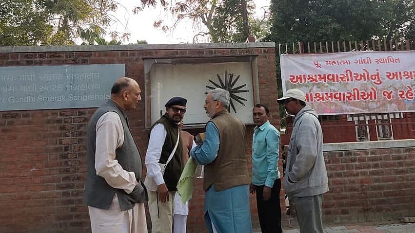 Nachiketa Desai (centre) being asked to leave Ashram by management.