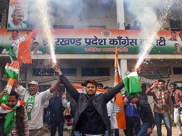 Celebrations outside state Congress office after the results became clear on Monday.