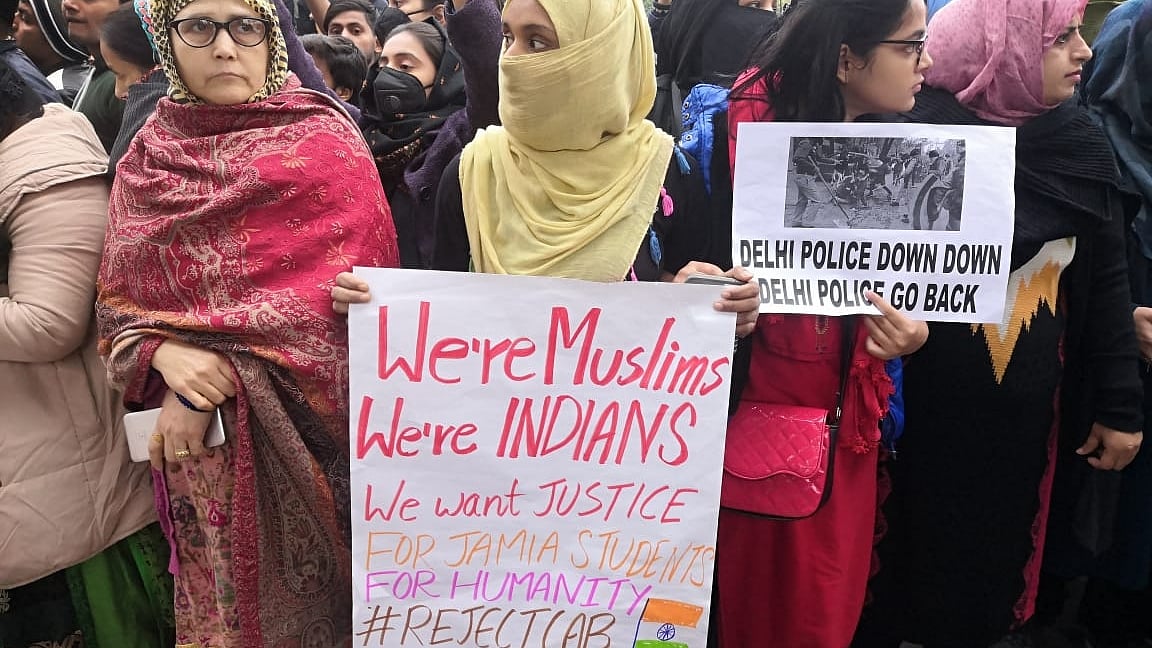 Muslim women stage a demonstration on at Jamia Nagar demanding justice for Jamia students after many of them sustained injuries in police crackdown a day earlier, on Sunday Dec 16, 2019. (IANS photo)