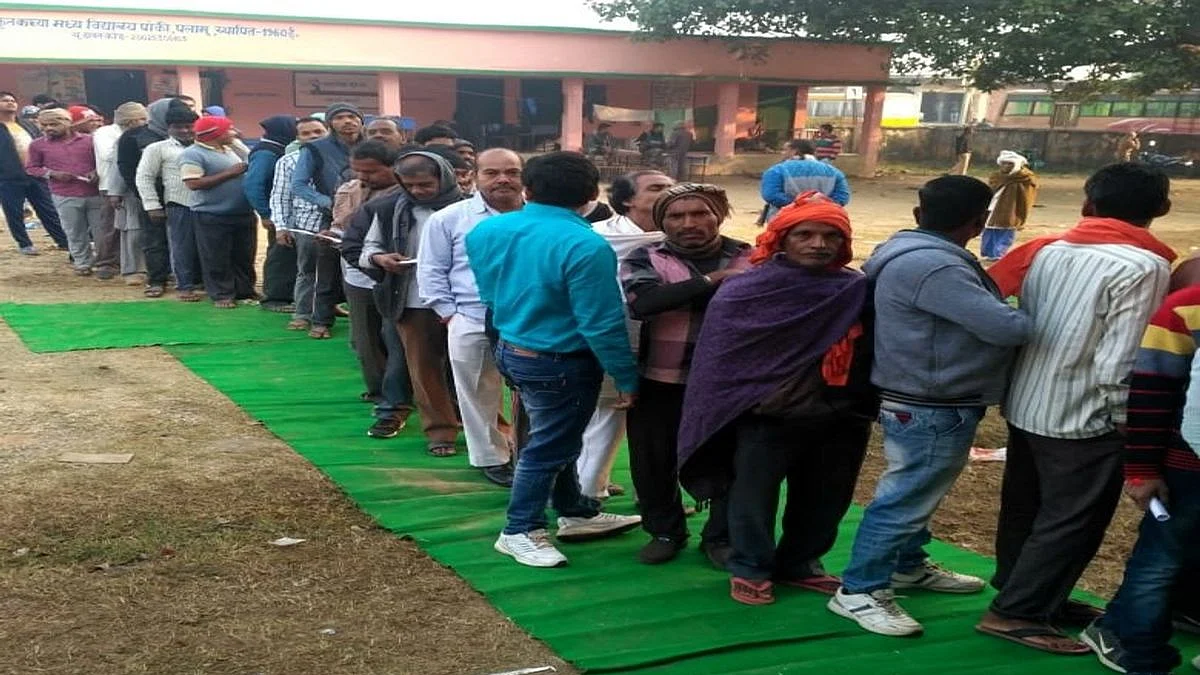  Voters queue up outside a polling station to cast their votes for the first phase of Jharkhand Assembly elections, in Palamu on Nov 30, 2019.