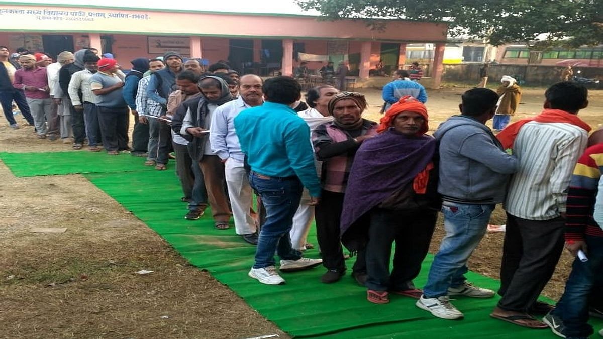  Voters queue up outside a polling station to cast their votes for the first phase of Jharkhand Assembly elections, in Palamu on Nov 30, 2019.