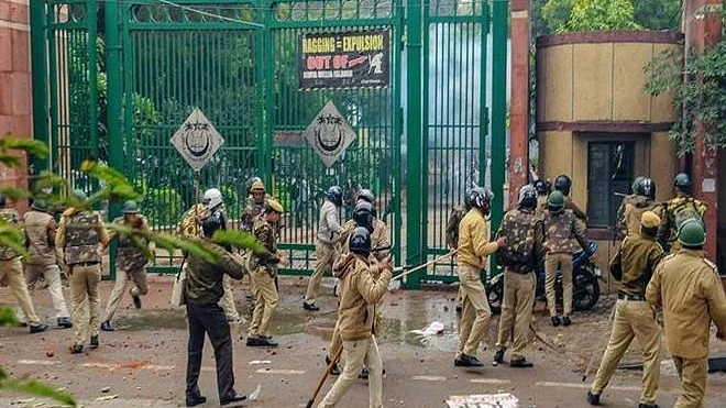 Police personnel outside Jamia Millia Islamia as students stage a protest against the Citizenship (Amendment) Act (PTI Photo) (File Photo)