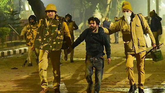 Police taking away a protester during anti-CAA protest in Aligarh Muslim University (PTI Photo-File)