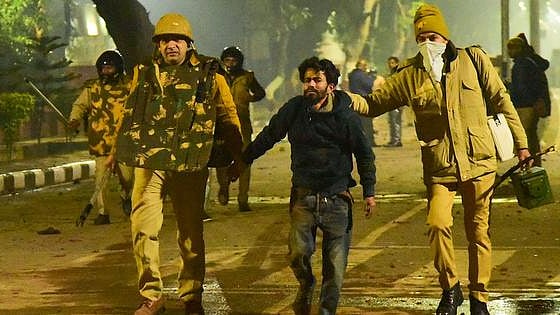 Police taking away a protester during anti-CAA protest in Aligarh Muslim University (PTI Photo-File)