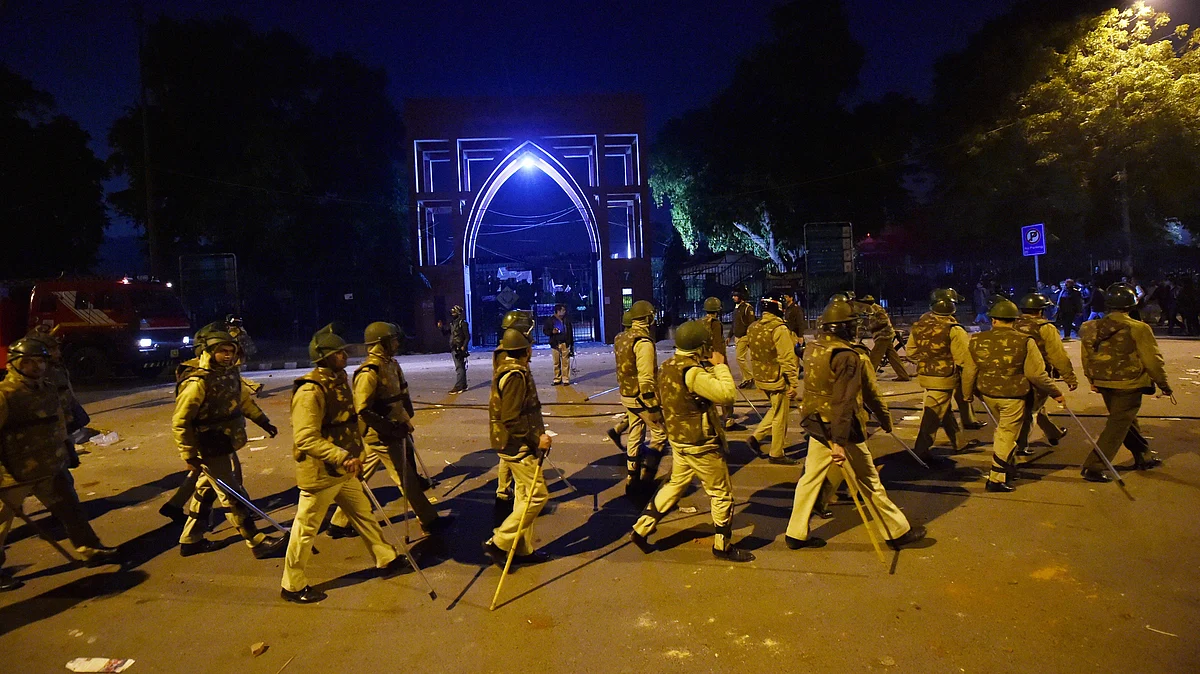 Policemen stand guard near Jamia Millia Islamia following the protests against Citizenship Amendment Act, in New Delhi, Sunday, Dec. 15, 2019 (PTI Photo)