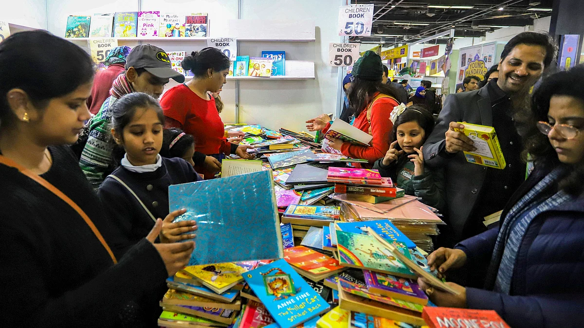 Visitors rummaging through books at the World Book Fair 2020 at Pragati Maidan. (PTI photo)