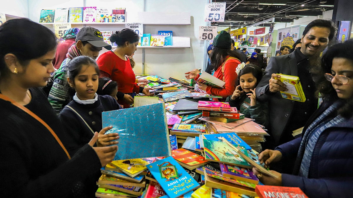 Visitors rummaging through books at the World Book Fair 2020 at Pragati Maidan. (PTI photo)