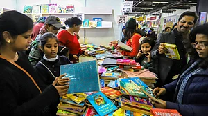Visitors rummaging through books at the World Book Fair 2020 at Pragati Maidan. (PTI photo)