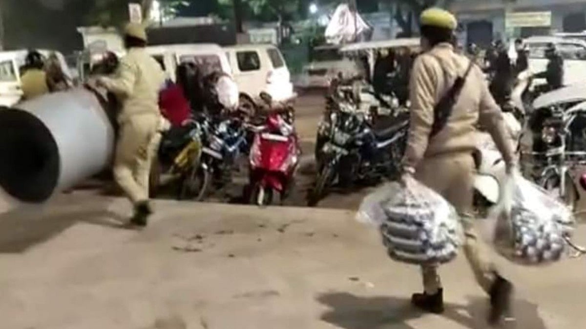 UP police taking away blankets from women protesters on Saturday night (Photo courtesy- social media)