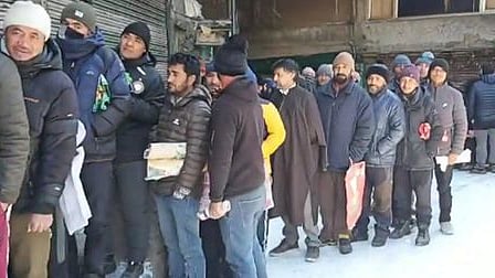 People lineup for fruits and vegetables in Kargil, Ladakh