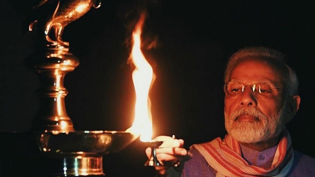 PM Narendra Modi lighting a lamp at his residence (Courtesy: social media)