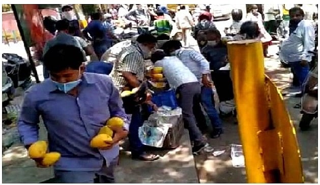 WATCH: Unruly crowd in Delhi robs street vendor of mangoes worth thousands  