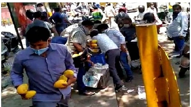WATCH: Unruly crowd in Delhi robs street vendor of mangoes worth thousands  