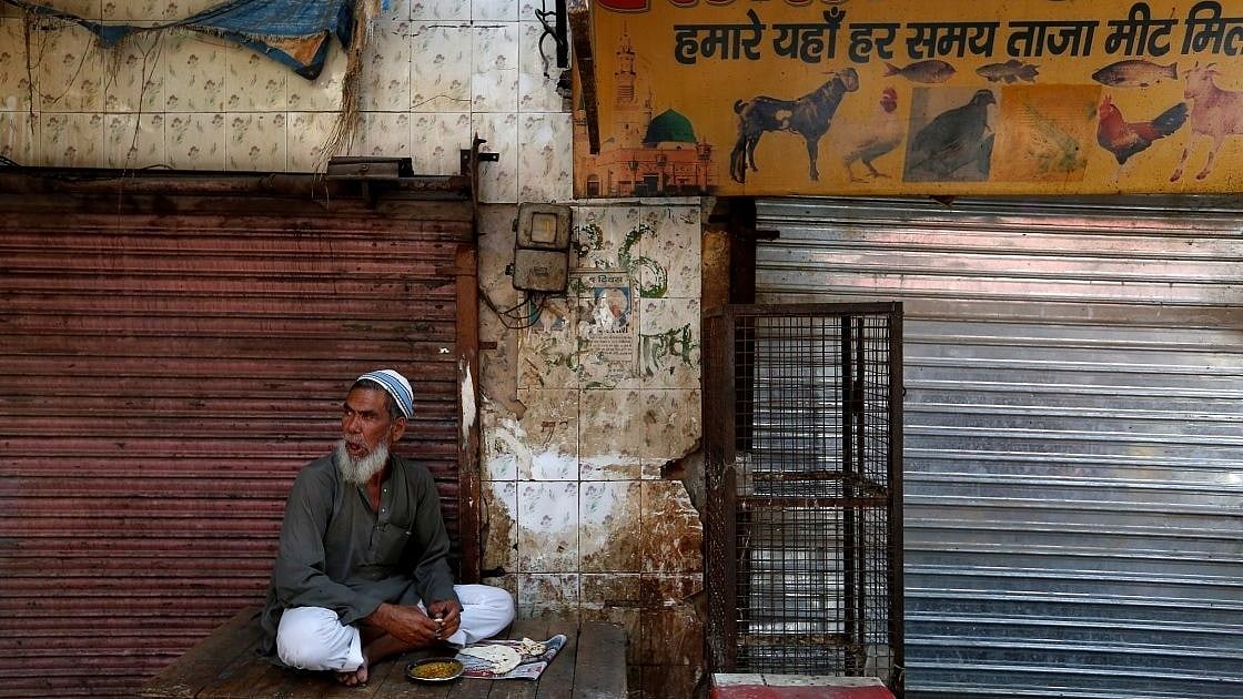 Meat seller outside his closed shop