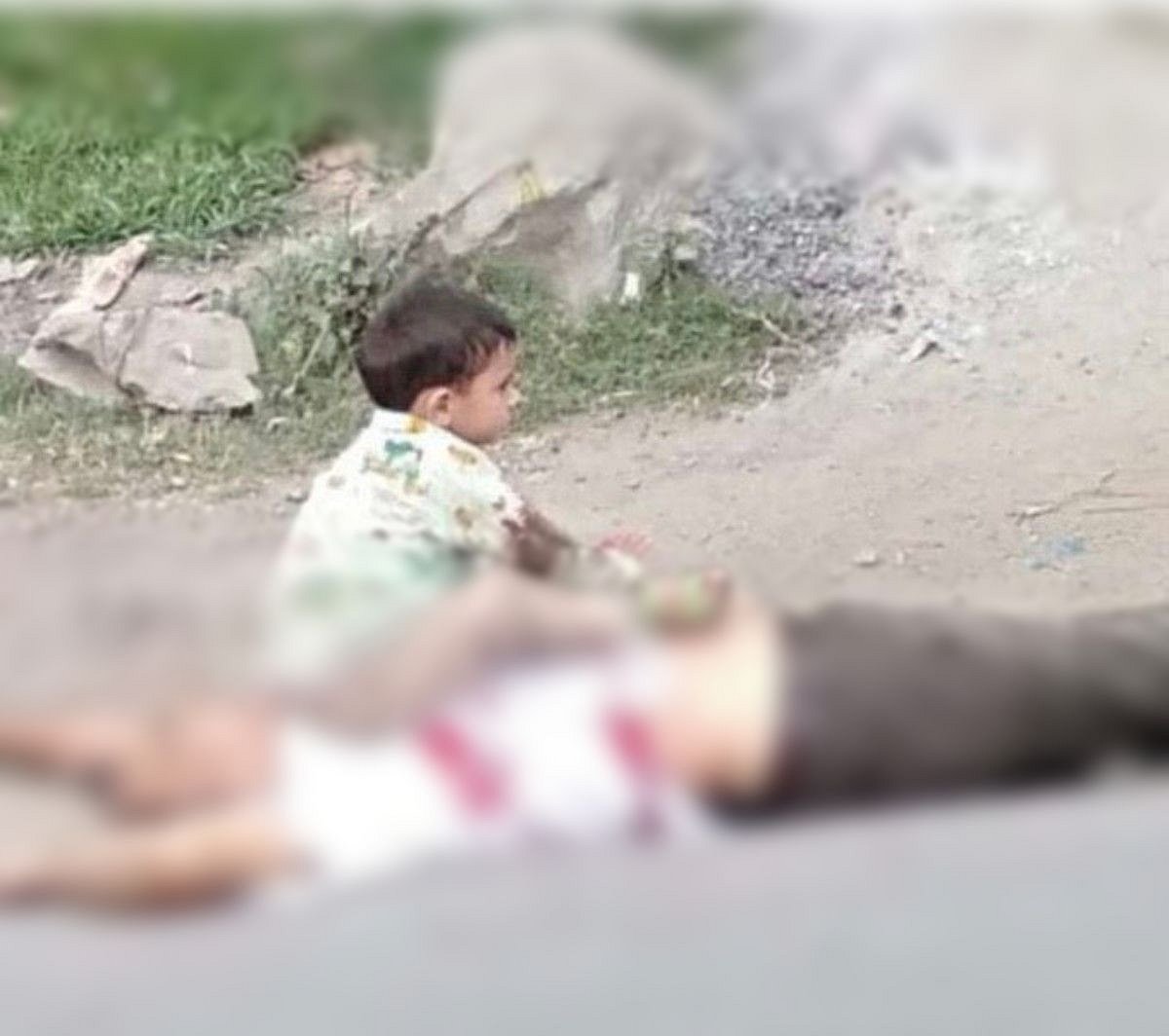 Photo of toddler sitting atop grandfather’s body latest addition to list of children caught in J&K conflict 