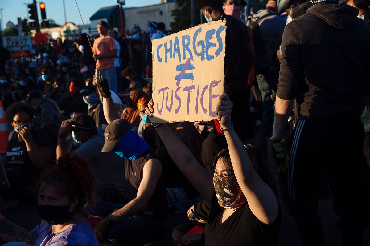 2 US policemen shot during protest, suspect held
