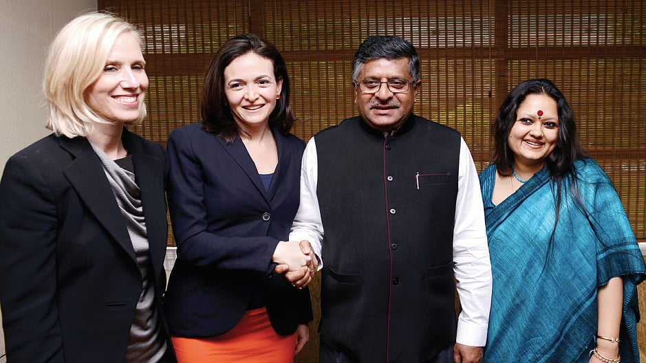 File photo of Union  Minister Ravi Shankar Prasad shaking hands with COO, Facebook Sheryl Sandberg. Facebook’s Global Public Policy Vice President Marne Levine and India Head of Public Policy Ankhi Das are also seen