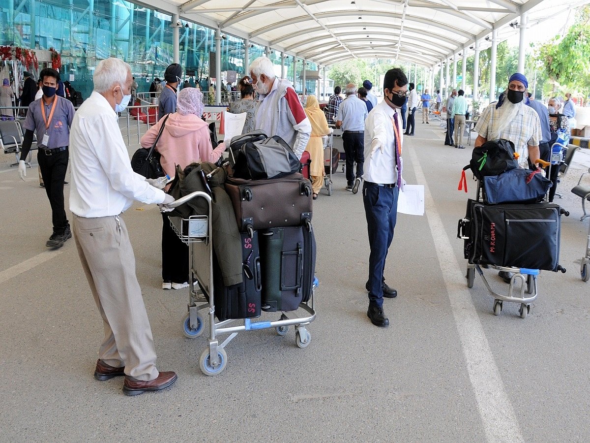 Fresh COVID-19 strain in UK: 262 passengers, 10 crew members stuck at Amritsar airport, relatives protest