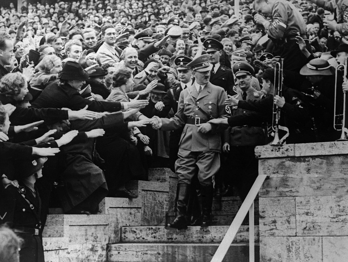 Adolf Hitler surrounded by an adoring crowd (Photo by Keystone/Getty Images)