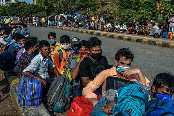 Fearing last year’s lockdown experience, migrant workers across India begin to leave for home       