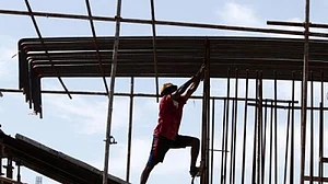 Crores of construction workers reel under misery even as Centre takes measures that go against their interests