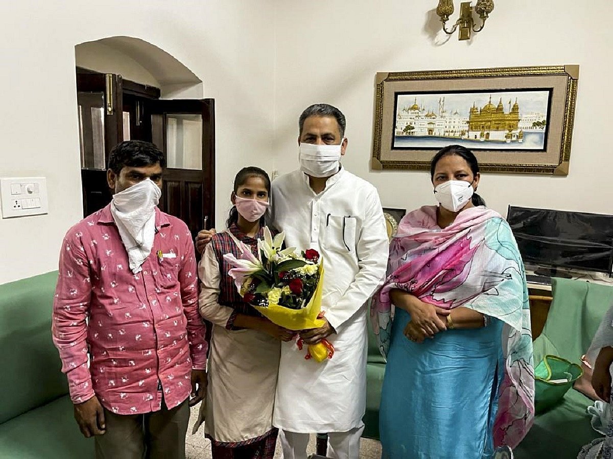 Punjab school education minister Vijay Inder Singla felicitates girl who topped NMMS exam