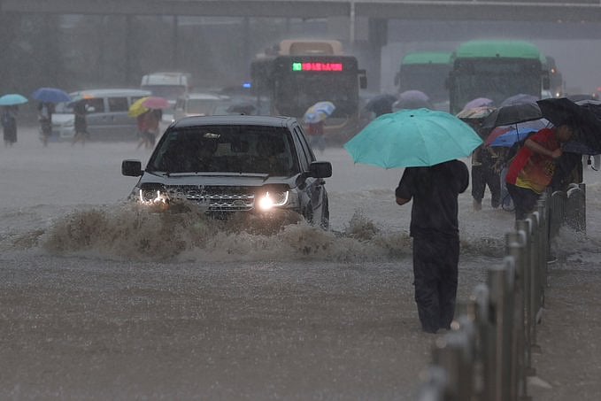 Flooding in central China turns streets to rivers, kills 12