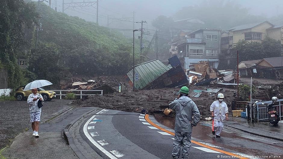 Rescuers slog through mud in Japan resort where 20 missing