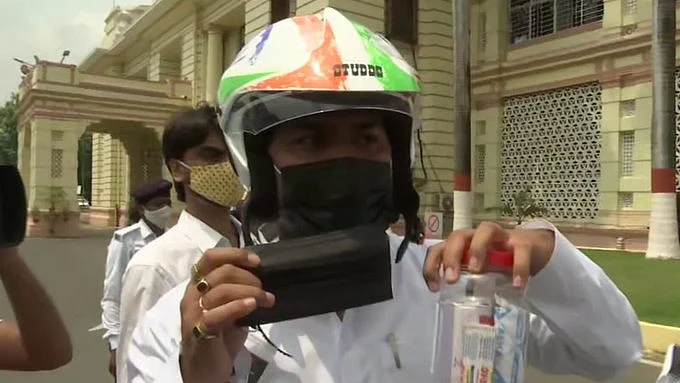 On day 1 of monsoon session in Bihar, RJD MLAs wear helmets, black masks to Assembly