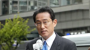 Japan's Parliament elects former diplomat Kishida as new PM